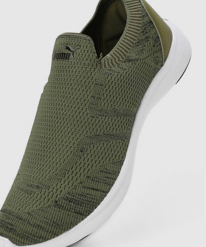 Side view of PUMA Men's Running Slip-On Sneakers, highlighting the breathable upper, cushioned midsole, durable outsole, and iconic PUMA logo, designed for comfort and performance in running and active wear.