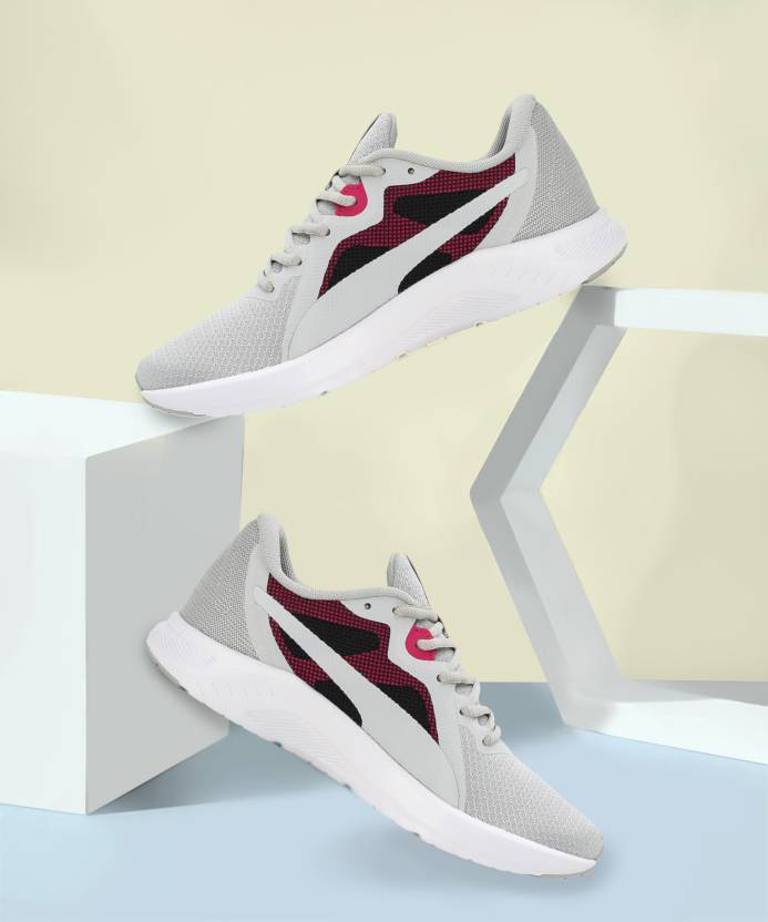 Side view of PUMA Women's Running Lace-Up Sneakers, showcasing the breathable upper, cushioned midsole, durable outsole, and iconic PUMA logo, designed for comfort and performance in running.