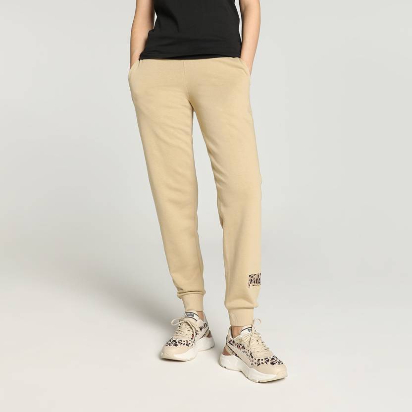 Side view of PUMA Women's Lower, highlighting the relaxed fit, soft fabric, and signature PUMA logo, perfect for casual wear and lifestyle activities.