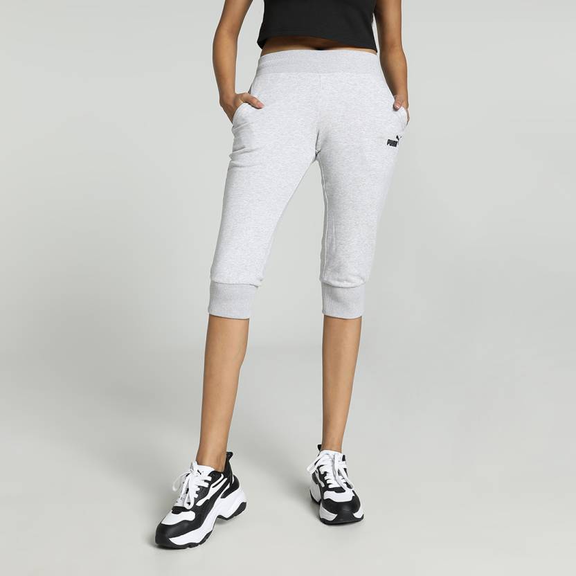 Side view of PUMA Women's Lower, highlighting the relaxed fit, soft fabric, and signature PUMA logo, perfect for casual wear and lifestyle activities.