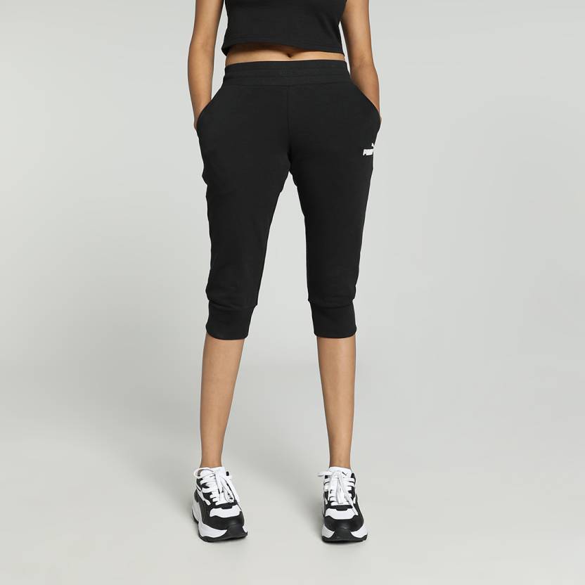 Side view of PUMA Women's Lower, highlighting the relaxed fit, soft fabric, and signature PUMA logo, perfect for casual wear and lifestyle activities.