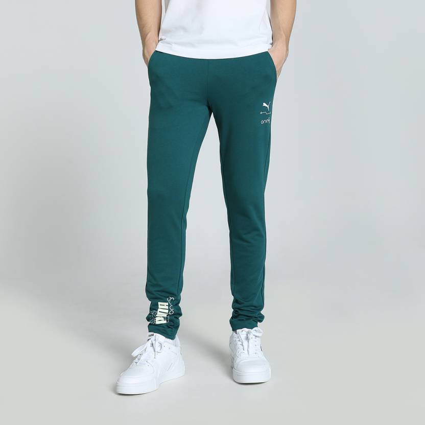 Side view of PUMA Men's Lower, showcasing its relaxed fit, breathable fabric, and signature PUMA logo for a casual, comfortable look.