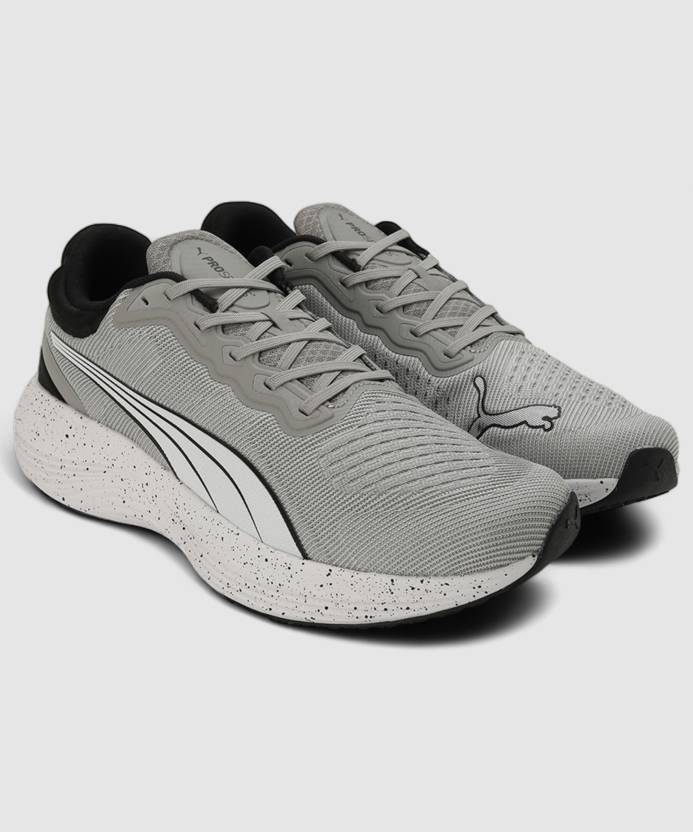 Side view of PUMA Men's Running Lace-Up Sneakers, showcasing the breathable upper, cushioned midsole, durable outsole, and iconic PUMA logo, designed for comfort and performance in running.