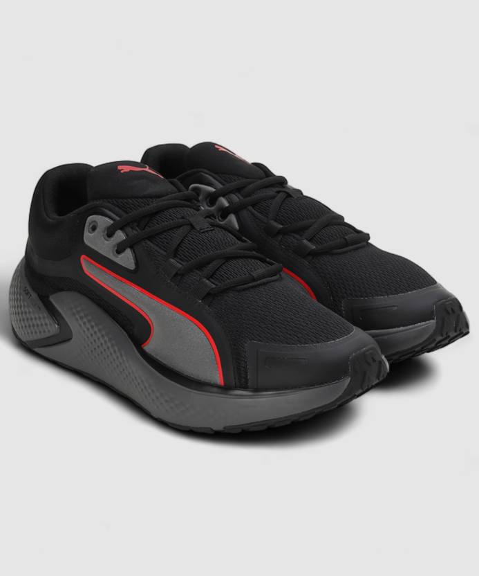 Side view of PUMA Men's Running Lace-Up Sneakers, showcasing the breathable upper, cushioned midsole, durable outsole, and iconic PUMA logo, designed for comfort and performance in running.