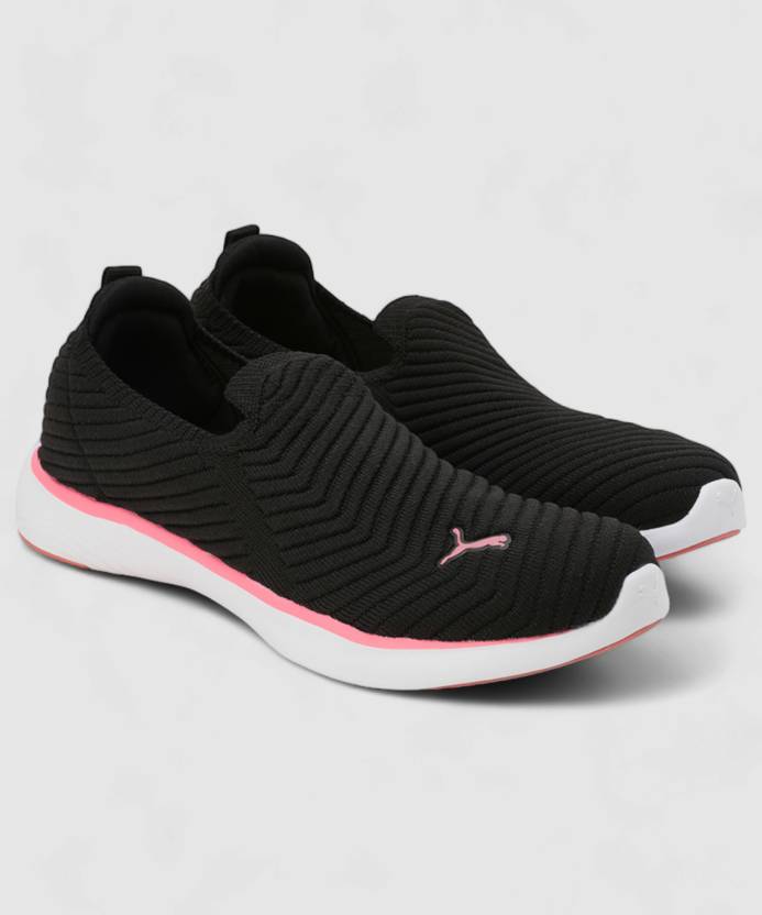 Side view of PUMA Women's Running Slip-On Sneakers, highlighting the breathable upper, cushioned midsole, durable outsole, and iconic PUMA logo, designed for comfort and performance in running and active wear.