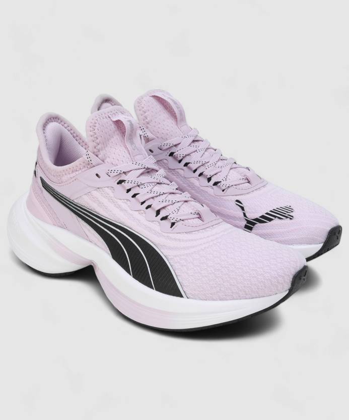 Side view of PUMA Women's Running Lace-Up Sneakers, showcasing the breathable upper, cushioned midsole, durable outsole, and iconic PUMA logo, designed for comfort and performance in running.