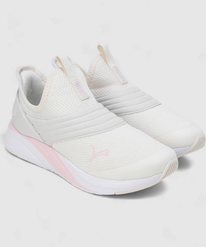 Side view of PUMA Women's Running Slip-On Sneakers, highlighting the breathable upper, cushioned midsole, durable outsole, and iconic PUMA logo, designed for comfort and performance in running and active wear.