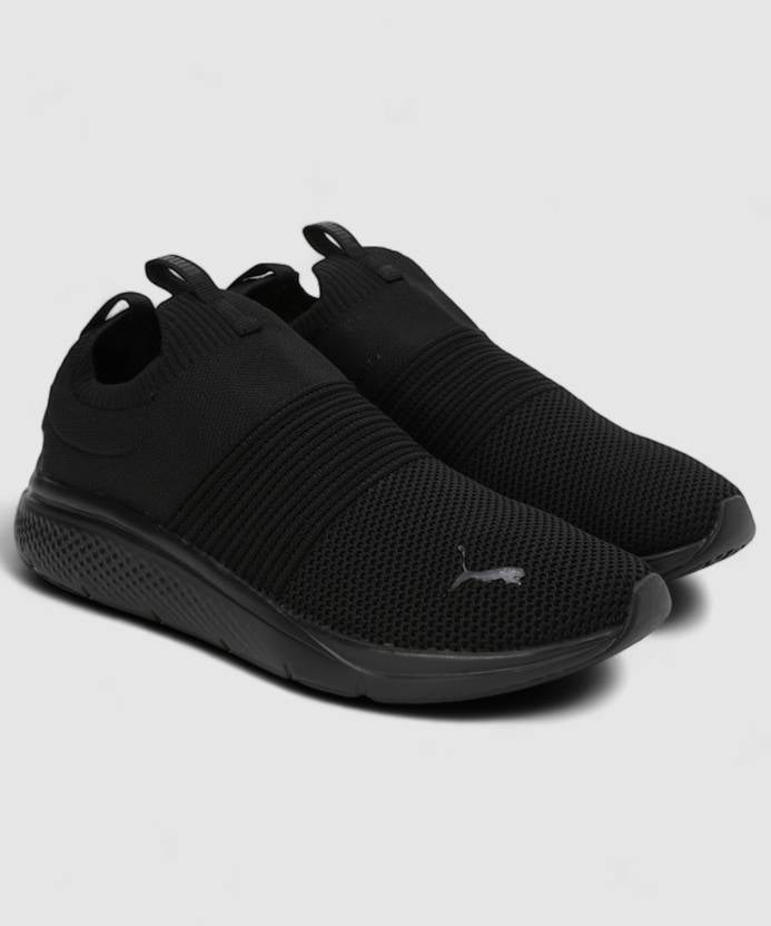 Side view of PUMA Men's Running Slip-On Sneakers, highlighting the breathable upper, cushioned midsole, durable outsole, and iconic PUMA logo, designed for comfort and performance in running and active wear.