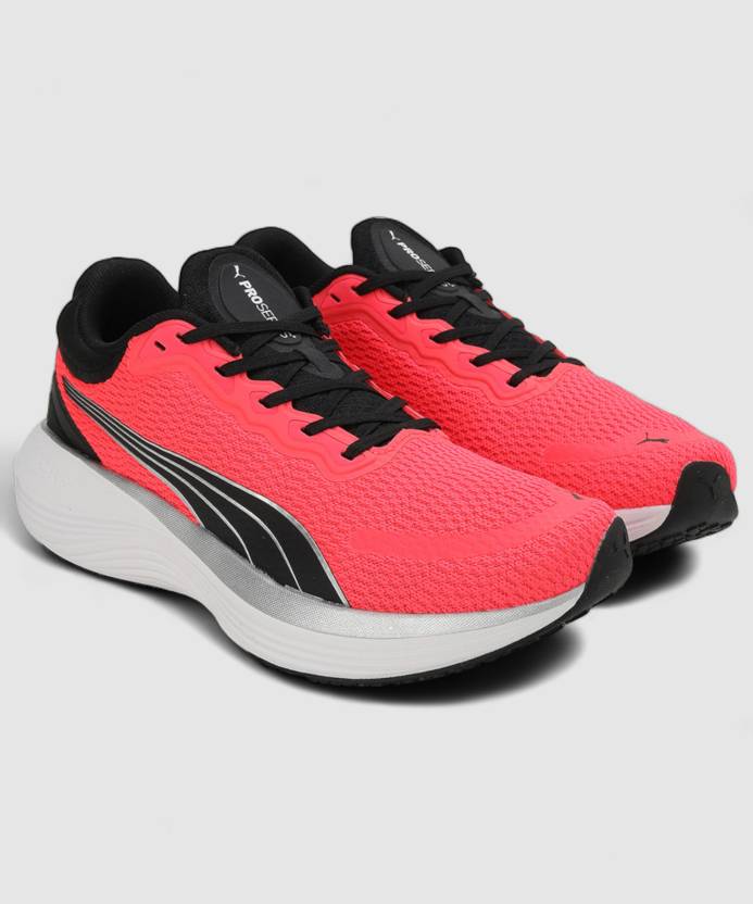 Side view of PUMA Women's Running Lace-Up Sneakers, showcasing the breathable upper, cushioned midsole, durable outsole, and iconic PUMA logo, designed for comfort and performance in running.