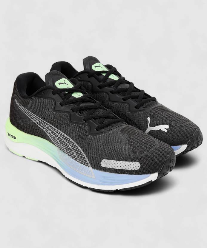 Side view of PUMA Men's Running Lace-Up Sneakers, showcasing the breathable upper, cushioned midsole, durable outsole, and iconic PUMA logo, designed for comfort and performance in running.