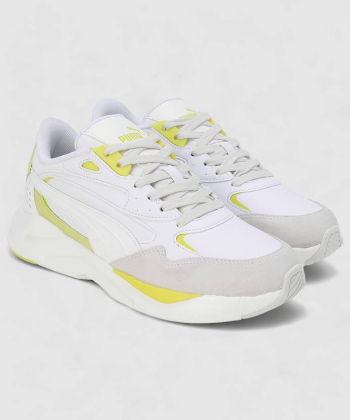 Side view of PUMA Women's Lifestyle Lace-Up Sneakers, showcasing the sleek design, breathable upper, cushioned insole, and iconic PUMA logo, designed for comfort and style in everyday wear.