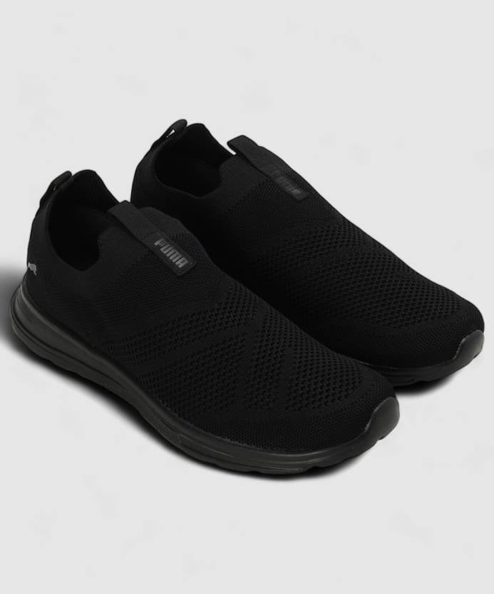 Side view of PUMA Men's Running Slip-On Sneakers, highlighting the breathable upper, cushioned midsole, durable outsole, and iconic PUMA logo, designed for comfort and performance in running and active wear.