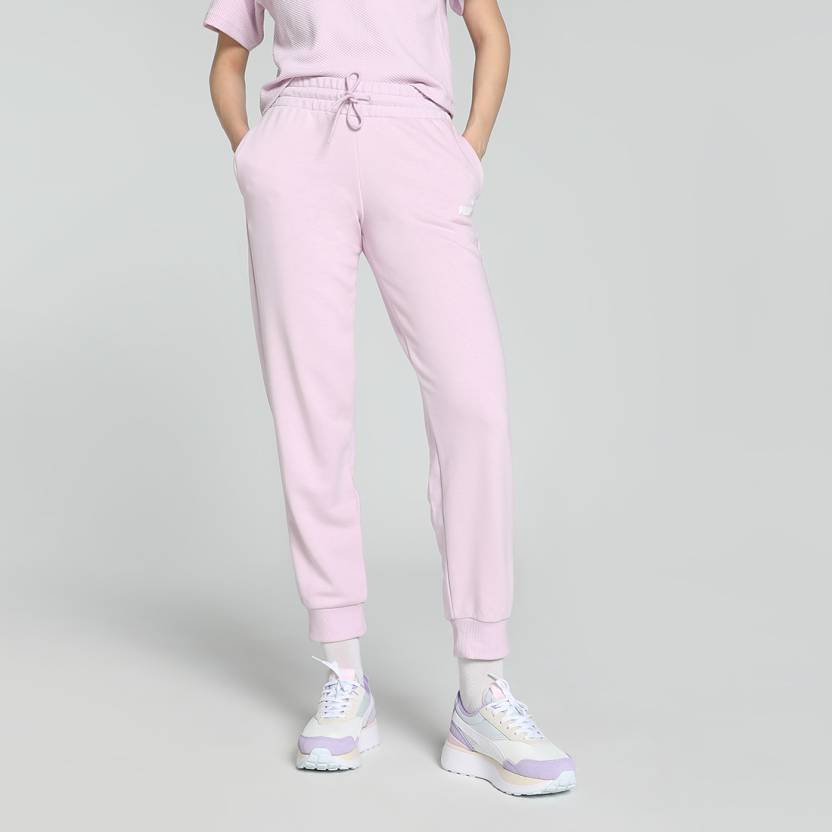 Side view of PUMA Women's Lower, highlighting the relaxed fit, soft fabric, and signature PUMA logo, perfect for casual wear and lifestyle activities.