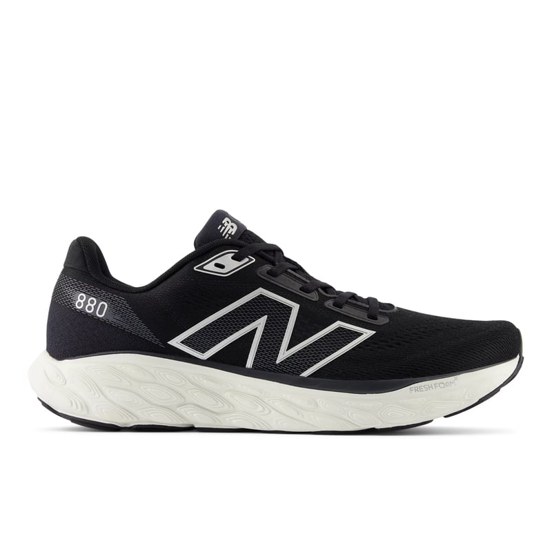 A side-angle view of New Balance men's running shoes highlighting the breathable mesh upper lace-up design and cushioned midsole placed on a clean background to emphasize their lightweight and athletic features.