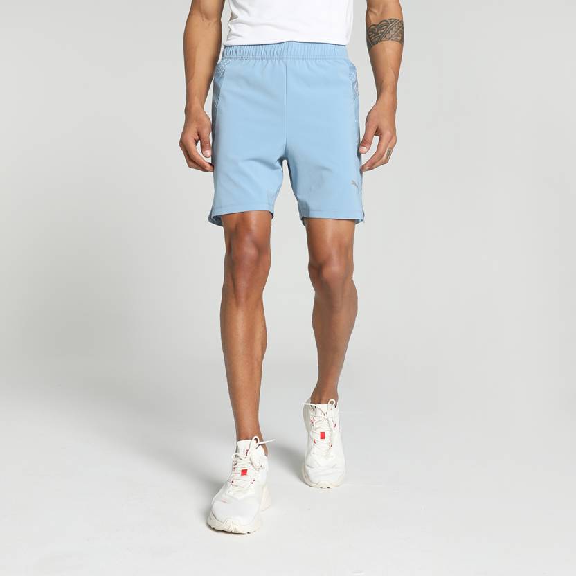 Side view of PUMA Men's Running Shorts, showcasing the lightweight, breathable fabric, moisture-wicking features, and signature PUMA logo, ideal for running and workouts.