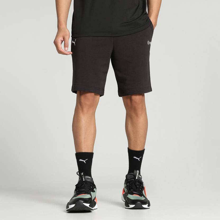 Side view of PUMA Men's Shorts, highlighting the relaxed fit, soft fabric, and signature PUMA logo for a comfortable and stylish casual look.