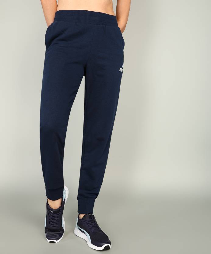 Side view of PUMA Women's Lower, highlighting the relaxed fit, soft fabric, and signature PUMA logo, perfect for casual wear and lifestyle activities.