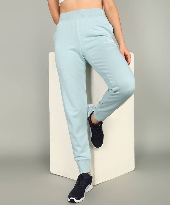 Side view of PUMA Women's Lower, highlighting the relaxed fit, soft fabric, and signature PUMA logo, perfect for casual wear and lifestyle activities.