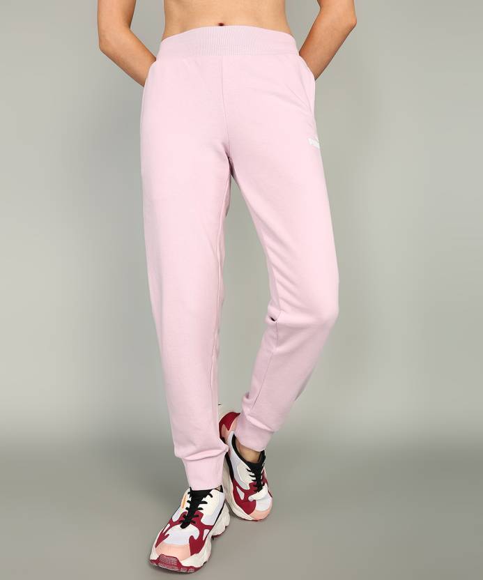 Side view of PUMA Women's Lower, highlighting the relaxed fit, soft fabric, and signature PUMA logo, perfect for casual wear and lifestyle activities.