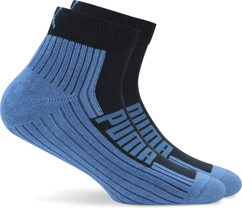 Side view of PUMA Men's Lifestyle PO2 Socks, showcasing the soft fabric, reinforced heels and toes, and iconic PUMA logo, designed for comfort and durability.