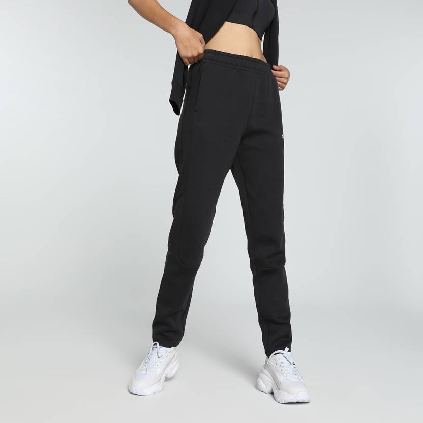 Side view of PUMA Women's Lower, highlighting the relaxed fit, soft fabric, and signature PUMA logo, perfect for casual wear and lifestyle activities.