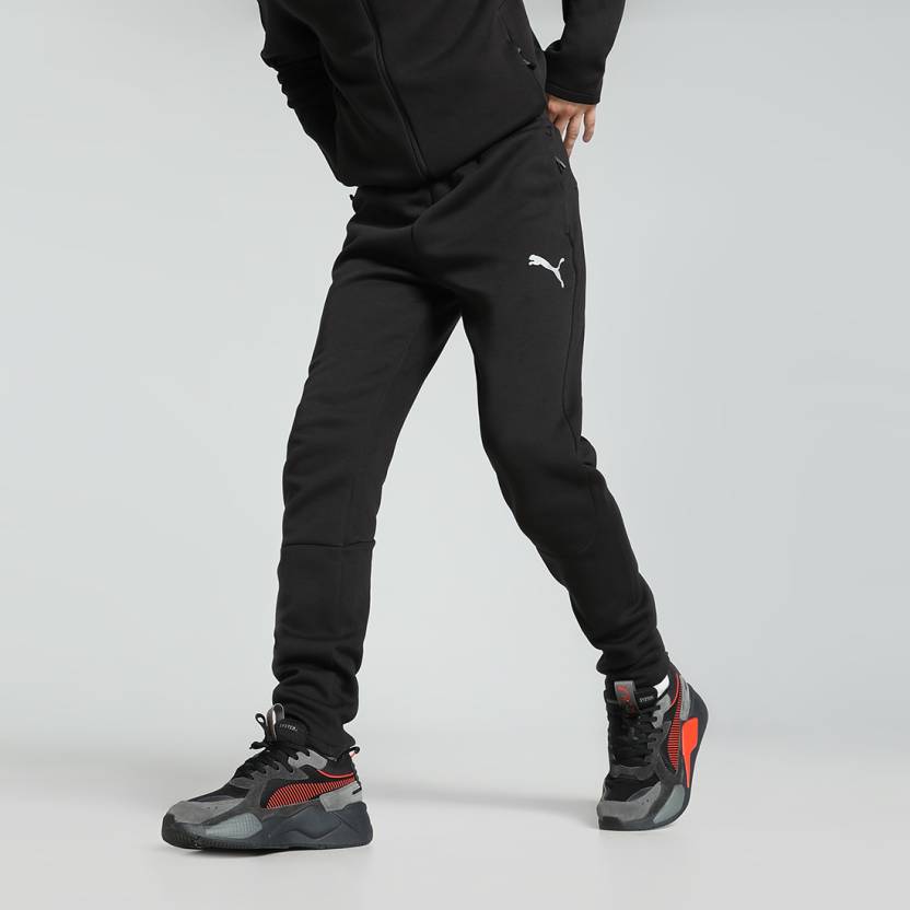 Side view of PUMA Men's Lower, showcasing its relaxed fit, breathable fabric, and signature PUMA logo for a casual, comfortable look.