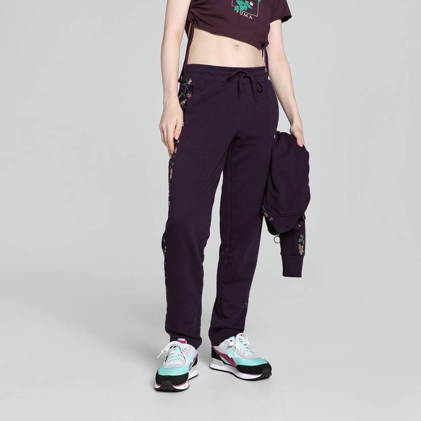 Side view of PUMA Women's Lower, highlighting the relaxed fit, soft fabric, and signature PUMA logo, perfect for casual wear and lifestyle activities.