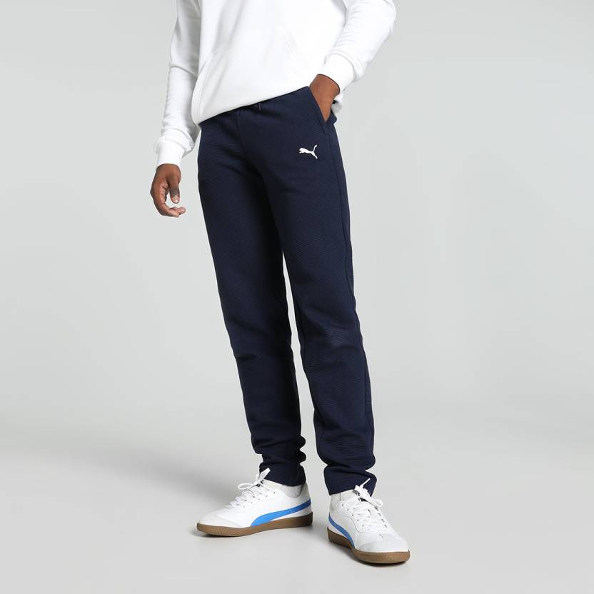 Side view of PUMA Men's Lower, showcasing its relaxed fit, breathable fabric, and signature PUMA logo for a casual, comfortable look.