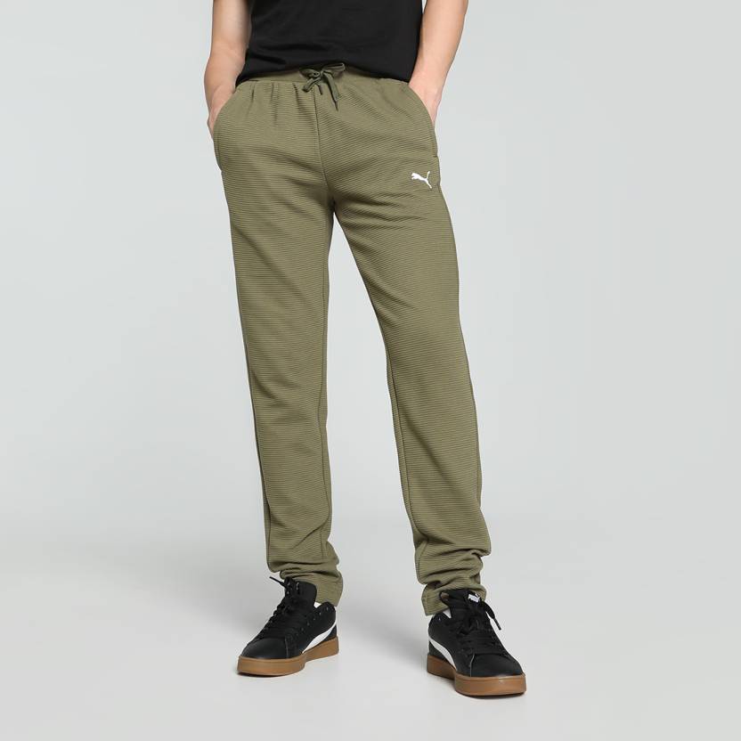 Side view of PUMA Men's Lower, showcasing its relaxed fit, breathable fabric, and signature PUMA logo for a casual, comfortable look.