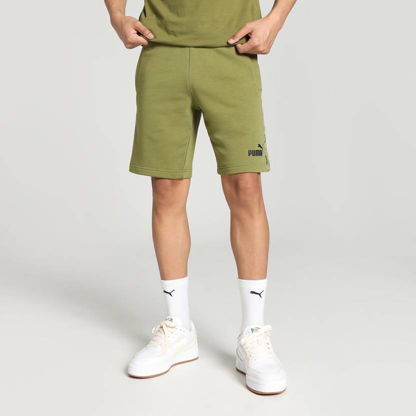 Side view of PUMA Men's Shorts, highlighting the relaxed fit, soft fabric, and signature PUMA logo for a comfortable and stylish casual look.