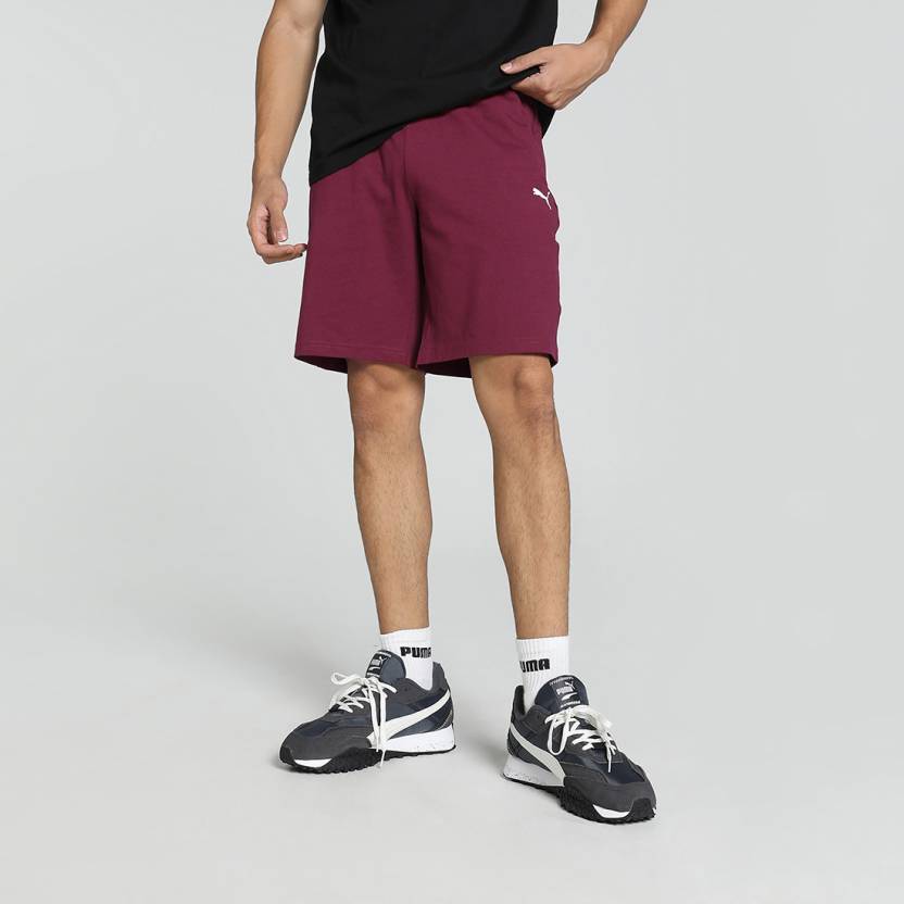 Side view of PUMA Men's Shorts, highlighting the relaxed fit, soft fabric, and signature PUMA logo for a comfortable and stylish casual look.