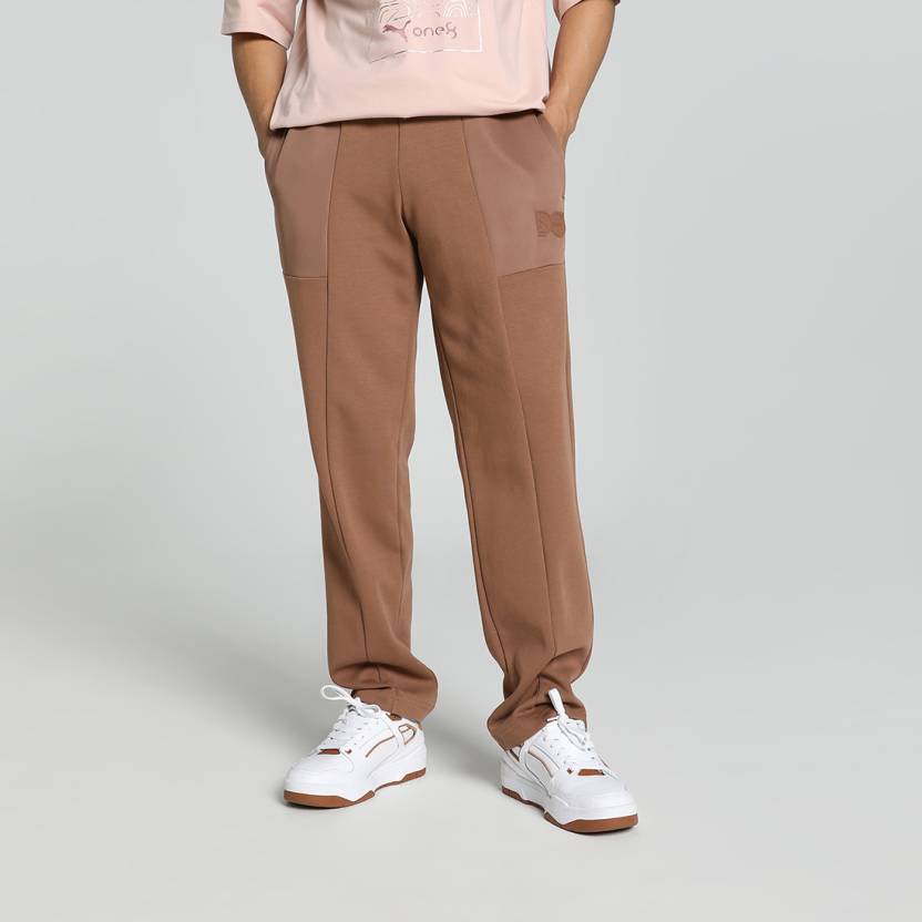 Side view of PUMA Men's Lower, showcasing its relaxed fit, breathable fabric, and signature PUMA logo for a casual, comfortable look.