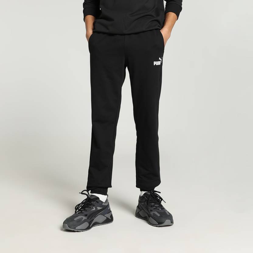 Side view of PUMA Men's Lower, showcasing its relaxed fit, breathable fabric, and signature PUMA logo for a casual, comfortable look.