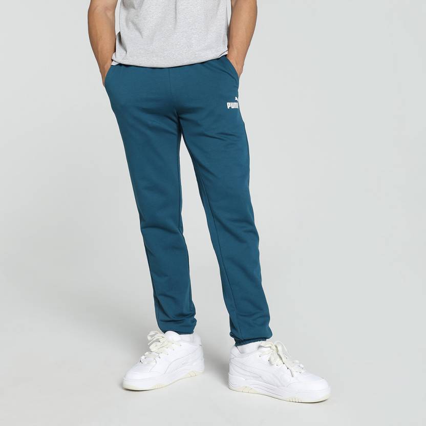 Side view of PUMA Men's Lower, showcasing its relaxed fit, breathable fabric, and signature PUMA logo for a casual, comfortable look.