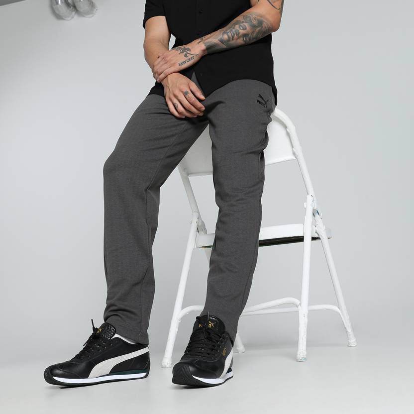 Side view of PUMA Men's Lower, showcasing its relaxed fit, breathable fabric, and signature PUMA logo for a casual, comfortable look.